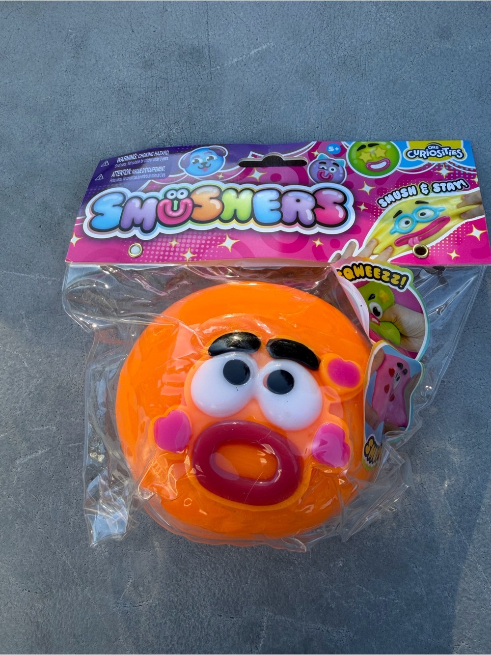 Authentic Orb Smushers Orange Squeeze Face Toy